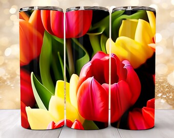 Può includere: Tre bicchieri in acciaio inossidabile con un design floreale colorato con tulipani rossi, gialli e verdi.