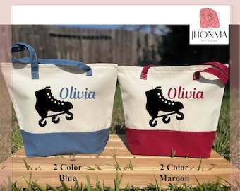 May include: Two personalized canvas tote bags with blue and maroon accents. Each bag features a black silhouette of roller skates and the name "Olivia" in white text.