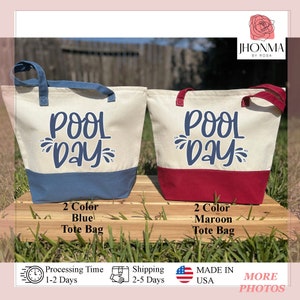 May include: Two tote bags with the text "Pool Day" in blue lettering. The bag on the left is blue and white, and the bag on the right is red and white.
