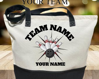 May include: White canvas tote bag with black handles and a black base. The bag features a bowling ball and pins graphic with the text "TEAM NAME" and "YOUR NAME".