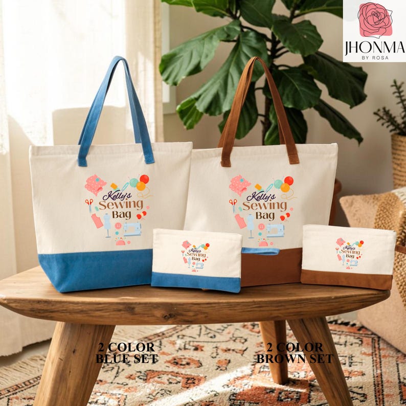 A set of three tote bags and two small bags, each with a different color, displayed on a wooden table. The bags have a sewing kit design and are labeled as "Kelsies Sewing Bag" and "Kelsies Sewing Bag".