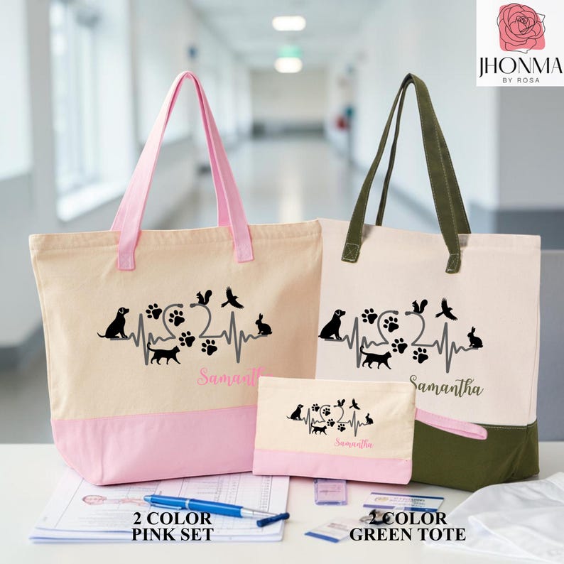 May include: Two canvas tote bags and a matching pouch featuring a black heartbeat graphic with animal silhouettes including a dog, cat, squirrel, bird, and rabbit, plus paw prints. One tote has pink handles and base, the other has olive green accents.