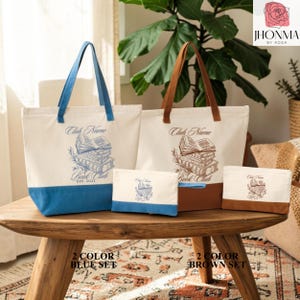 a set of four tote bags and a small bag, each with a unique design and color, arranged on a wooden table.
