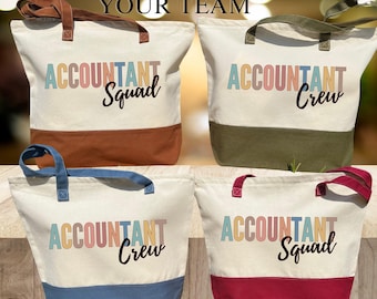 May include: Four canvas tote bags with different coloured accents. Each bag has the text "Accountant" in rainbow colours and either "Squad" or "Crew" in black text.