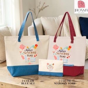 two tote bags, one blue and one maroon, with the text "Kelly's Sewing Bag" printed on them. The bags are placed on a wooden surface, and there is a couch in the background.
