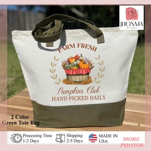 May include: A green canvas tote bag with a white design featuring the text "FARM FRESH" and "Pumpkins Club HAND PICKED DAILY". The design also includes a basket of pumpkins with a red and white checkered cloth.
