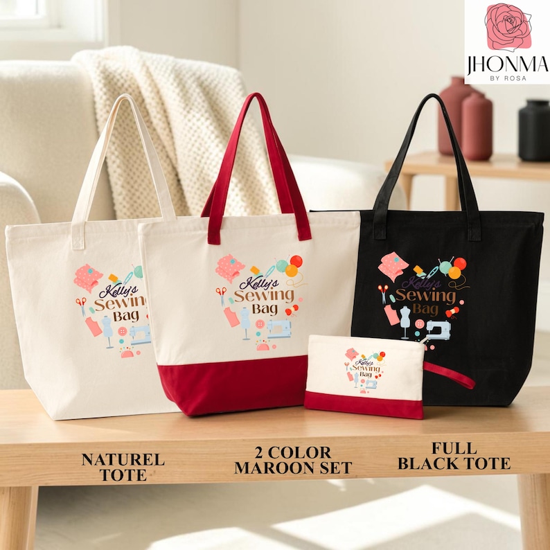 Three tote bags with sewing-themed designs and text, including a natural tote, a maroon tote, and a black tote, displayed on a wooden surface.