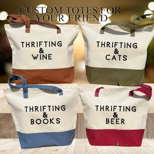 May include: Four canvas tote bags with different colored accents and text that reads "Thrifting & Wine", "Thrifting & Cats", "Thrifting & Books", and "Thrifting & Beer".