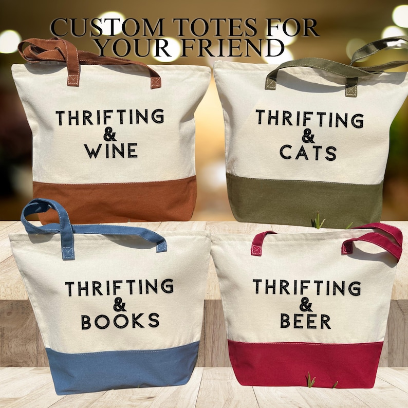 May include: Four canvas tote bags with different colored accents and text that reads "Thrifting & Wine", "Thrifting & Cats", "Thrifting & Books", and "Thrifting & Beer".