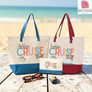 May include: Two canvas tote bags and one matching zippered pouch. One tote has blue handles and base, the other has red handles and base. Both feature the text "Cruise Stuff" with a name and a cruise ship graphic. Tortoiseshell sunglasses are included.