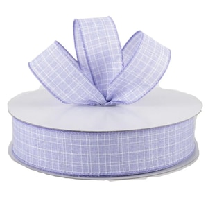 May include: A spool of lavender-colored ribbon with a white checkered pattern. The ribbon is 2.5 inches wide and is made of a soft, textured fabric.