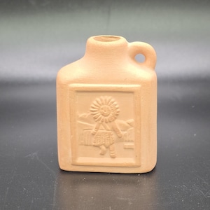 May include: A set of three ceramic mugs with a speckled, matte finish. The mugs are in shades of cream, light gray, and dark gray. Each mug has a simple, minimalist design, perfect for coffee or tea.