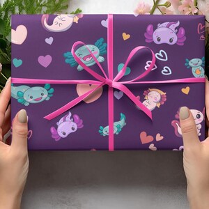 purple gift wrap with pink blue and lilac axolotls