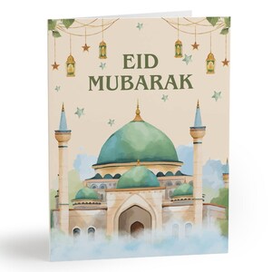 May include: A greeting card with a watercolor illustration of a mosque with green domes and minarets. The card has the text "Eid Mubarak" in green lettering.