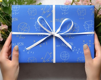 May include: A blue gift box wrapped in paper with a white ribbon. The paper has a pattern of white mathematical equations and geometric shapes.