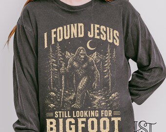 Comfort Colors® I Found Jesus Bigfoot Long Sleeve Shirt Still Looking For Sasquatch Funny Christian Humor Vintage Cryptid Lover Gift