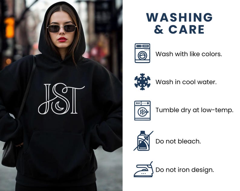 May include: A black hooded sweatshirt with a white JST design on the front. The image also includes washing instructions: wash with like colors, wash in cool water, tumble dry at low-temp, do not bleach, and do not iron design.