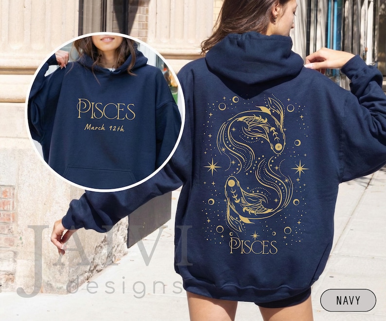 May include: Navy blue hoodie with gold text and graphics. The front features the word "PISCES" and "March 12th". The back displays a gold illustration of two fish, stars, and the word "PISCES".