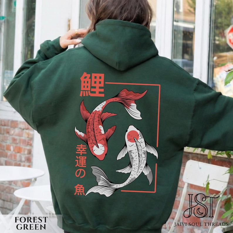 May include: Forest green hoodie featuring a Japanese koi fish design. The back of the hoodie displays two koi fish in red and white, with Japanese characters and a red rectangular border. The hoodie has a drawstring hood.
