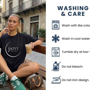May include: A black t-shirt with the text "JAIVI designs" in a white circular design. The image also shows washing instructions: wash with like colors, wash in cool water, tumble dry at low-temp, do not bleach, and do not iron design.
