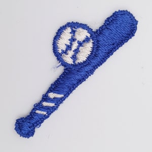 May include: Blue embroidered baseball bat with a white baseball attached to the end.