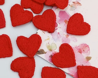 May include: A collection of red felt heart shapes, ideal for crafting or decorating.