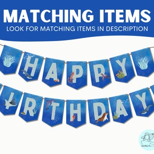Peut inclure: Banni&egrave;re bleue et blanche avec les mots "Joyeux anniversaire !" en lettres blanches. La banni&egrave;re pr&eacute;sente diverses cr&eacute;atures marines, notamment une baleine, un hippocampe, une &eacute;toile de mer et une tortue de mer.