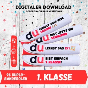 May include: Three white and red paper tubes with the word "du" printed in red. Each tube has a different message printed on it: "Findest viele neue Freunde", "Bist jetzt ein Schulkind", and "Lernt das 1x1". The tubes are stacked on top of each other. The text "93 Duplo-Banderolen 1. Klasse" is printed below the tubes.