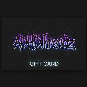 May include: A rectangular gift card with a black background. The text ADHDThreadz is written in a stylized, graffiti-inspired font with a glowing purple and blue neon outline. Below the brand name, the words GIFT CARD appear in white text.