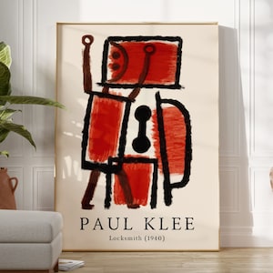 Puede incluir: Un póster vintage con una pintura abstracta de Paul Klee titulada "Locksmith (1940)". La pintura es en rojo, negro y blanco y representa una figura estilizada.