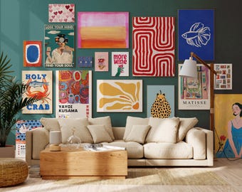 May include: A teal wall adorned with framed art prints, including abstract designs, a crab illustration, and a betta fish. The prints feature text such as "LOSE YOUR MIND FIND YOUR SOUL". A beige sofa and wooden coffee table are in front of the wall.