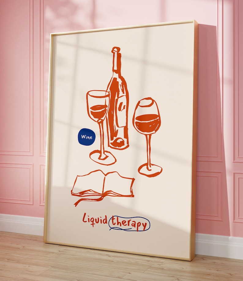 May include: A framed illustration of two wine glasses and a bottle of wine with the text "Liquid Therapy" and "Wine" in a blue circle. The illustration is in orange on a cream background.