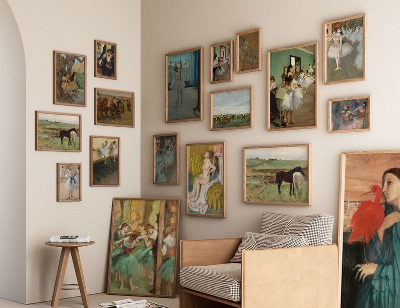 May include: A wall gallery featuring framed artwork of dancers, horses, and landscapes. The gallery is decorated with a variety of styles and colors, including black and white, sepia tones, and vibrant hues. The artwork is displayed on a white wall with a light brown wooden floor.