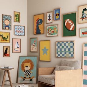 May include: A gallery wall of framed art prints featuring whimsical illustrations. The collection includes a dinosaur, a lion on a skateboard, a football, a pineapple with sunglasses, and a rocket ship. The color palette includes blues, yellows, and greens.