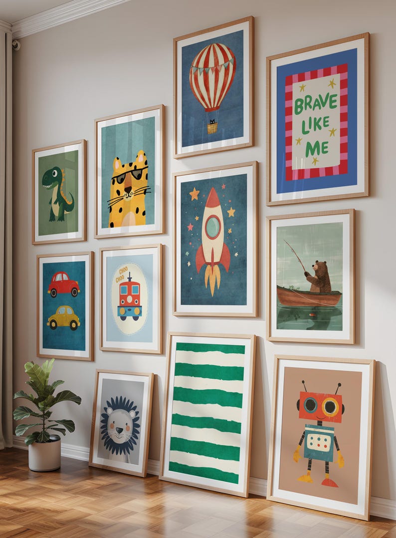 May include: A collection of framed art prints with a children's theme. The prints feature illustrations of a dinosaur, a tiger wearing sunglasses, a hot air balloon, a rocket, a bear fishing, cars, a train, a lion, a robot, and the text "BRAVE LIKE ME".