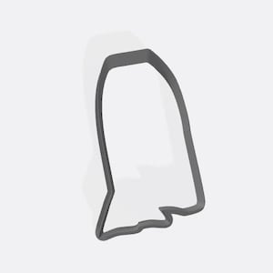 May include: A gray ghost-shaped cookie cutter. The cutter has a rounded top and a wavy bottom edge. The outline is a dark gray color, and the interior is white. The cookie cutter is designed for making Halloween-themed treats.