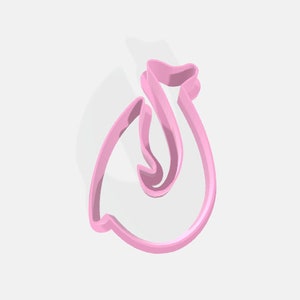 May include: A pink plastic cookie cutter shaped like a swan. The swan has its head turned to the side and its wings are spread out.