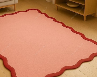 Roze wollen vloerkleed | Modern golvend tapijt met geschulpte randen