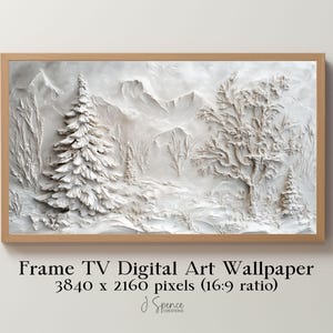 May include: A white, textured, 3D wall art piece depicting a snowy mountain scene with trees. The art is framed in a light brown wood frame. The text "Frame TV Digital Art Wallpaper 3840 x 2160 pixels (16:9 ratio)" is printed below the frame.