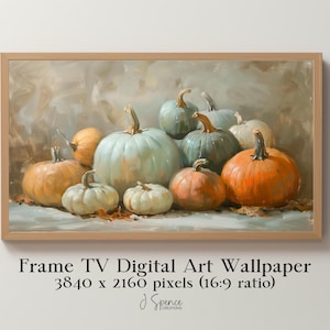May include: A framed digital art print featuring a still life of pumpkins in various colors, including orange, white, and teal. The artwork is set against a neutral background. The text on the image reads "Frame TV Digital Art Wallpaper".