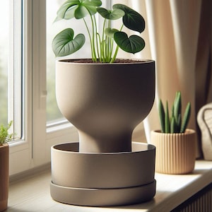 May include: A light brown ceramic planter with a wide, rounded base and a narrow neck. The planter has a matching saucer and is filled with a green leafy plant.