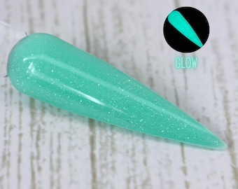 Bass Drop: polvo de inmersión en tonos pastel neón azul verdoso que brilla en la oscuridad para uñas de verano.