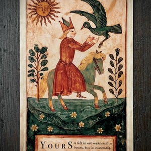 May include: A rectangular tarot card featuring a medieval-style illustration of a person in a crown and red robe riding a green horse. A dark bird flies above, and a sun with a face shines. Text reads: YOURS A life is not measured in hours, but in ownership.