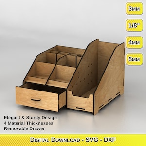 May include: A wooden desktop organizer with a drawer and multiple compartments. The organizer is made of light brown wood and has a removable drawer. The text "Elegant & Sturdy Design 4 Material Thicknesses Removable Drawer" is printed below the organizer. The text "DIGITAL DOWNLOAD - SVG - DXF" is printed below the text. The text "3mm", "1/8"
