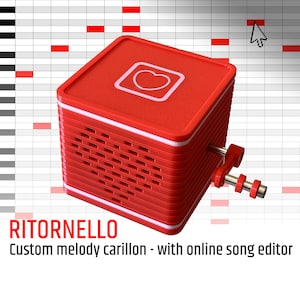 May include: A red, cube-shaped musical instrument with a heart-shaped logo and a winding mechanism. The instrument is called "RITORNELlO" and is described as a "Custom melody carillon - with online song editor".