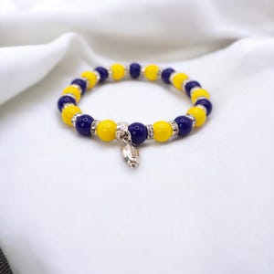 Pulsera de cuentas de vidrio azules y amarillas del día del juego con dije personalizado