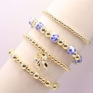 Gold and Chinoiserie Beaded Bracelet Stack with Bow Charm | Set of 4 Stretch Bracelets