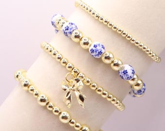 Gold and Chinoiserie Beaded Bracelet Stack with Bow Charm | Set of 4 Stretch Bracelets