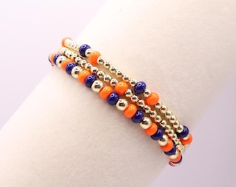 Pulsera azul marino y naranja Game Day con cuentas rellenas de oro