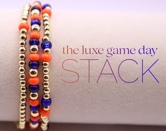 Pulsera azul y naranja Game Day con cuentas rellenas de oro